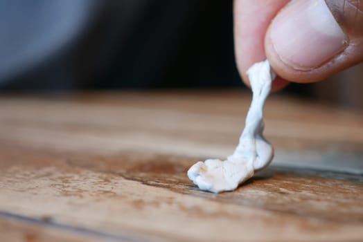 effectively removing chewing gum, with closeup view focus.