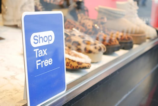 A 'Tax Free' sign displayed at a store, inviting shoppers to enjoy tax-free purchases.