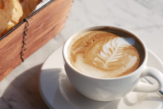 Coffee cup on wood table .