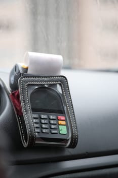 POS machine on yellow taxi .