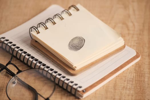 putting fingerprints on a paper close up