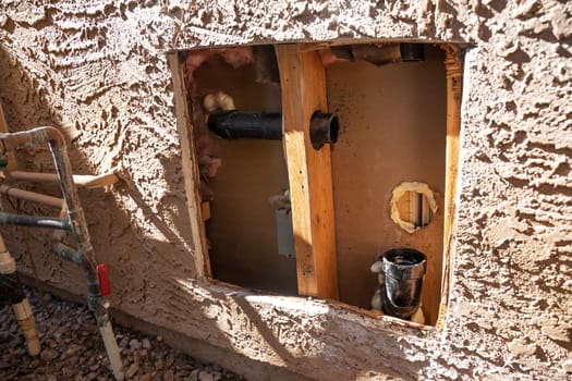Cut Pipe System, Plumbing Repair Service. External Wall of House with Broken Pipe. Repairing Water Supply. Nobody. Construction. Horizontal Plane. Maintenance of Leakage. High quality photo