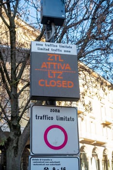 Cremona, Italy - November 27th 2024 Electronic sign displaying ztl attiva (ztl active) and ltz closed indicating an active limited traffic zone in cremona, italy, with supporting signage