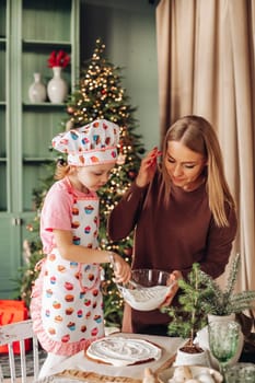 kitchen with a Christmas tree is preparing or cooking ginger cookies for Christmas or New year