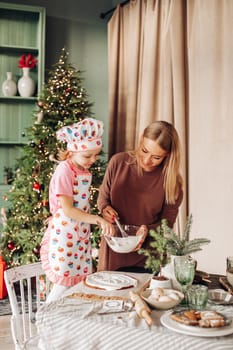 kitchen with a Christmas tree is preparing or cooking ginger cookies for Christmas or New year
