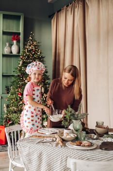 kitchen with a Christmas tree is preparing or cooking ginger cookies for Christmas or New year