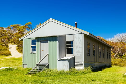 The historic Schlink Hut in Kosciuszko National Park near Schlink Pass on a clear summer's day, in the Snowy Mountains, New South Wales, Australia