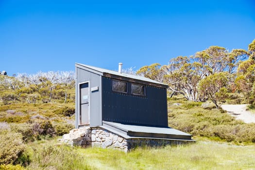 The historic Schlink Hut in Kosciuszko National Park near Schlink Pass on a clear summer's day, in the Snowy Mountains, New South Wales, Australia
