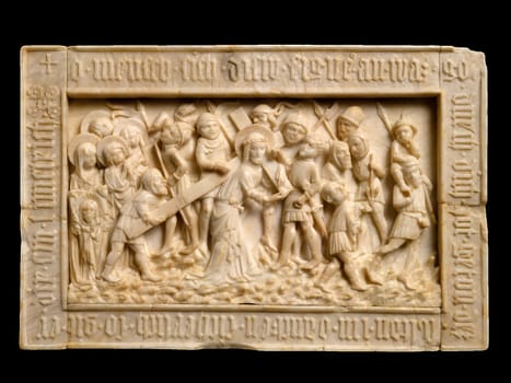 Ivory relief sculpture of The Road to Calvary, attributed to the Master of the Lorsch Calvary, depicting Christ carrying the cross with Mary and a procession of figures.