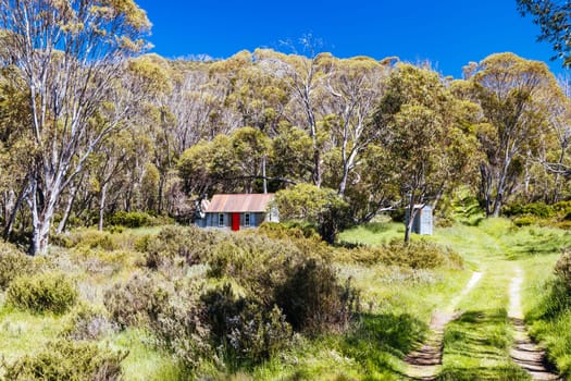 The historic Horse Camp Hut in Kosciuszko National Park near Schlink Pass on a clear summer's day, in the Snowy Mountains, New South Wales, Australia