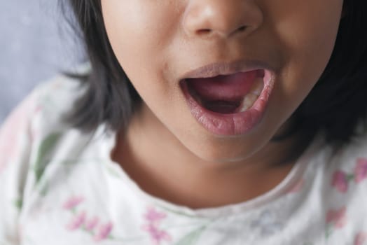 close up of child screaming at home , slow motion