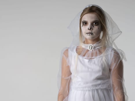 Sturio portrait of Little girl in Halloween ghost costume