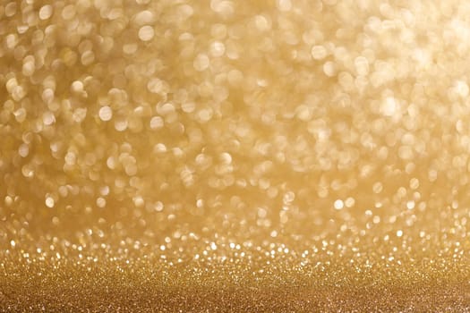 Shiny golden bokeh glitter lights abstract background, Christmas New Year party celebration concept