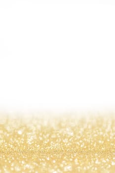 Shiny golden bokeh glitter lights abstract background, Christmas New Year party celebration concept