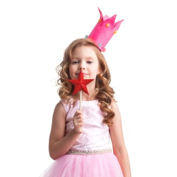 Little fairy girl in Halloween pink dress and crown with magic wand putting spell, isolated on white background