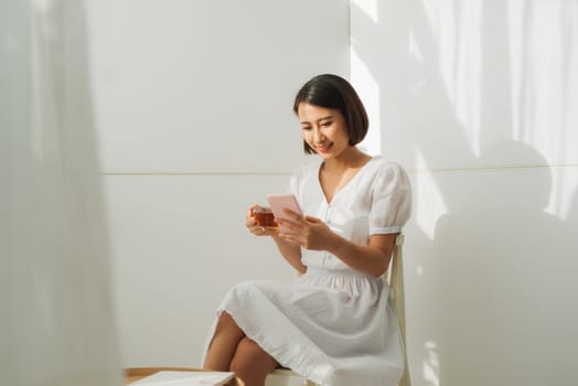 young asian woman using smart phone