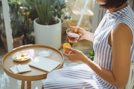 Girl relaxed reading a book and drinking coffee in livingroom