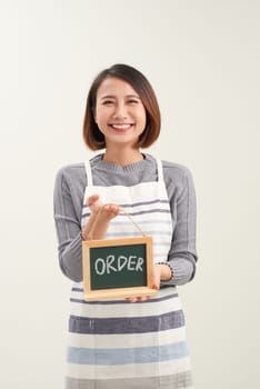 Waitress holding the chalkboard order sign on white background