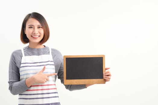 happy waitress holding blank chalkboard sign