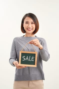 excited happy beautiful young woman with sale sign isolated over white