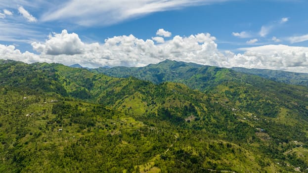 Aerial drone of mountain range with green tropical vegetation. Negros, Philippines