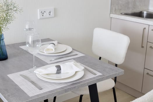 A stylish dining area with a minimalist table and beautiful contemporary decor that provides a chic ambiance