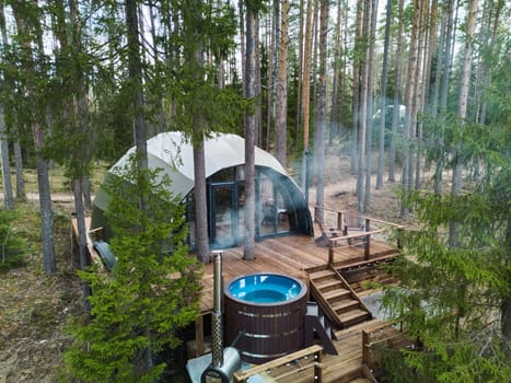 A oneofakind dome accommodation tucked away in the serene woods, complete with a hot tub for ultimate relaxation