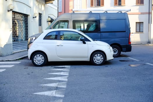 Cremona, Itally - October 6th 2024 Compact and modern white fiat 500 cult on display in an urban setting, highlighting its sleek design and small size