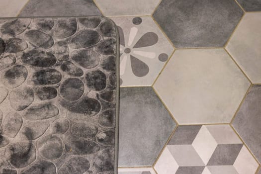 Shot of the mat on the tile floor of the bathroom