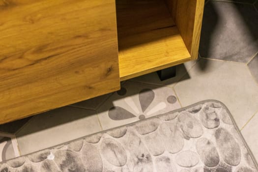 Shot of the mat on the tile floor of the bathroom
