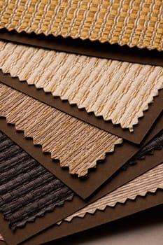 This is a collection of beautiful fabric samples showcasing rich textures and warm colors for interior design