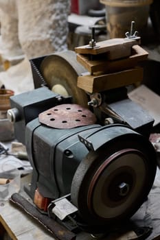 This is an antique grinding machine that demonstrates tools that were historically used for precision craftsmanship
