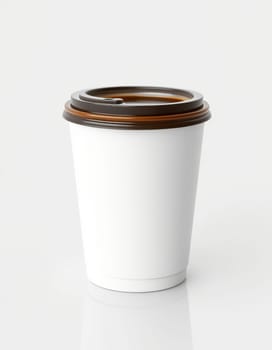 A plain white coffee cup with a brown lid sits against a neutral background, perfect for custom branding or cafe designs. Features a simple, clean aesthetic for versatility.