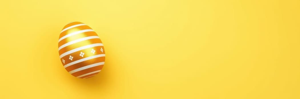 A beautifully decorated golden egg with white stripes rests on a vibrant yellow backdrop. This festive display captures the spirit of Easter and spring celebrations.