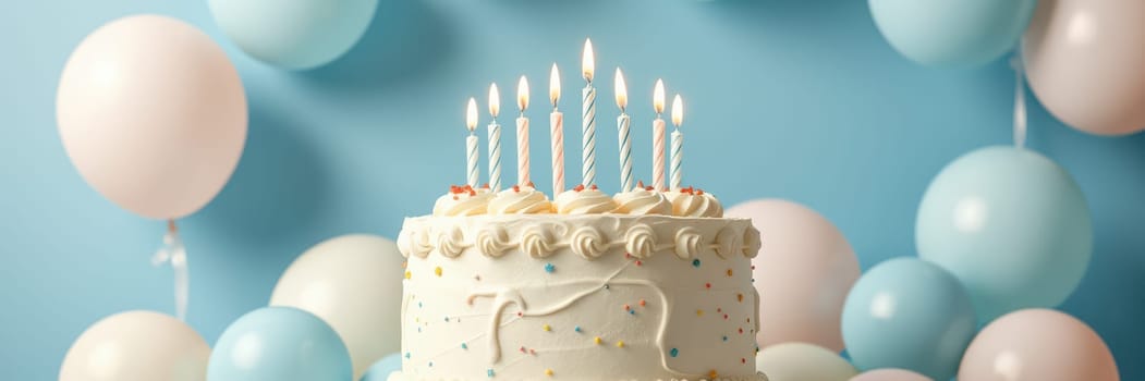 A delicious birthday cake with lit candles sits on display, surrounded by pastel balloons that enhance the joyful atmosphere of a birthday celebration.