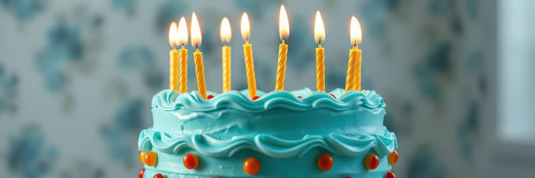 A delightful birthday cake adorned with blue frosting and bright candles is displayed on a table, surrounded by a cheerful atmosphere perfect for a festive celebration.