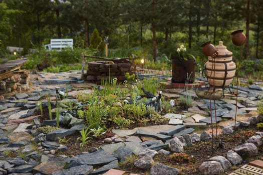A beautifully serene garden retreat, featuring winding stone pathways, lush greenery, and charming rustic decor