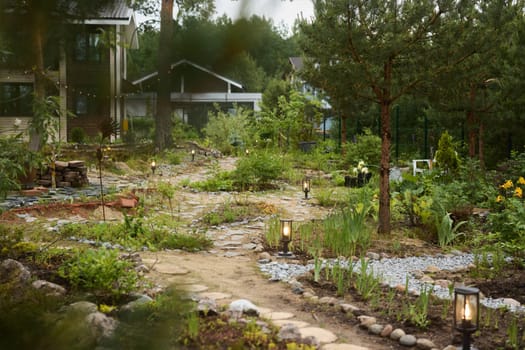 A tranquil garden with a winding pathway, vibrant plants, and gentle lighting that enhance the serene atmosphere