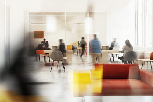 A contemporary office environment showcasing people engaged in work and collaboration, characterized by bright lighting and a spacious design.