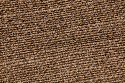 This is a detailed closeup showing a textured brown fabric, which is ideal for various design and media projects
