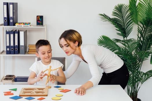 Teacher Playing Educational Games With Boy