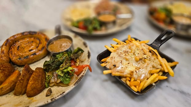 mouthwatering German worst curled up cumberland sausage meal featuring a grilled sausage, loaded cheese fries, and fresh vegetables served on a rustic plate. Perfect for dinner lovers appreciating hearty and flavorful dishes.