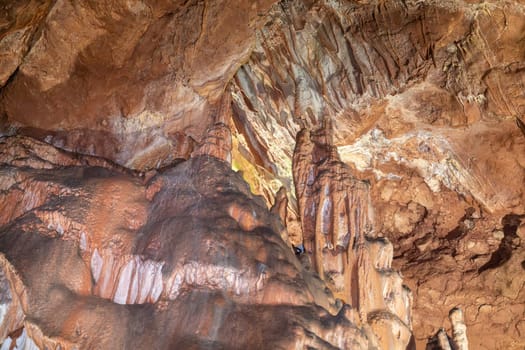 A cave with a lot of rocks and a person in the middle