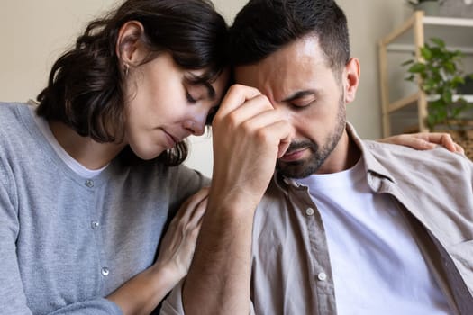 Close up of woman comforting husband. Lifestyle concept.