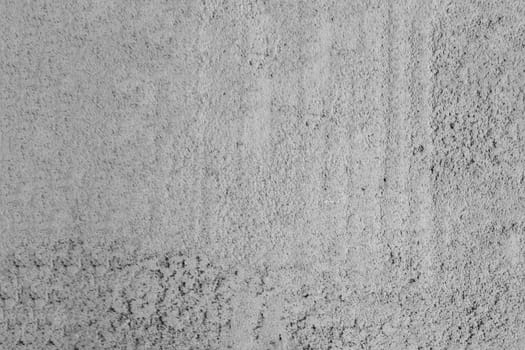 Gray freshly cemented wall close-up. Plaster coating.