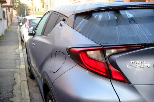 Cremona, Itally - October 6th 2024 Sleek lines and a distinctive rear define the parked toyota c-hr hybrid, highlighting its contemporary style and eco-conscious engineering
