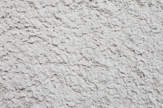 Rough gray plaster on the wall close-up. Concrete wall background.