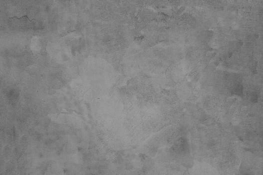 Close-up photo of old plaster on a concrete wall.