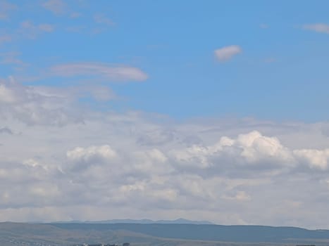 blue gray beautiful sky, white clouds, background weather nature air atmosphere. Landscape High quality photo