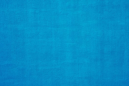 Blue color with an old grunge wall concrete texture as a background.